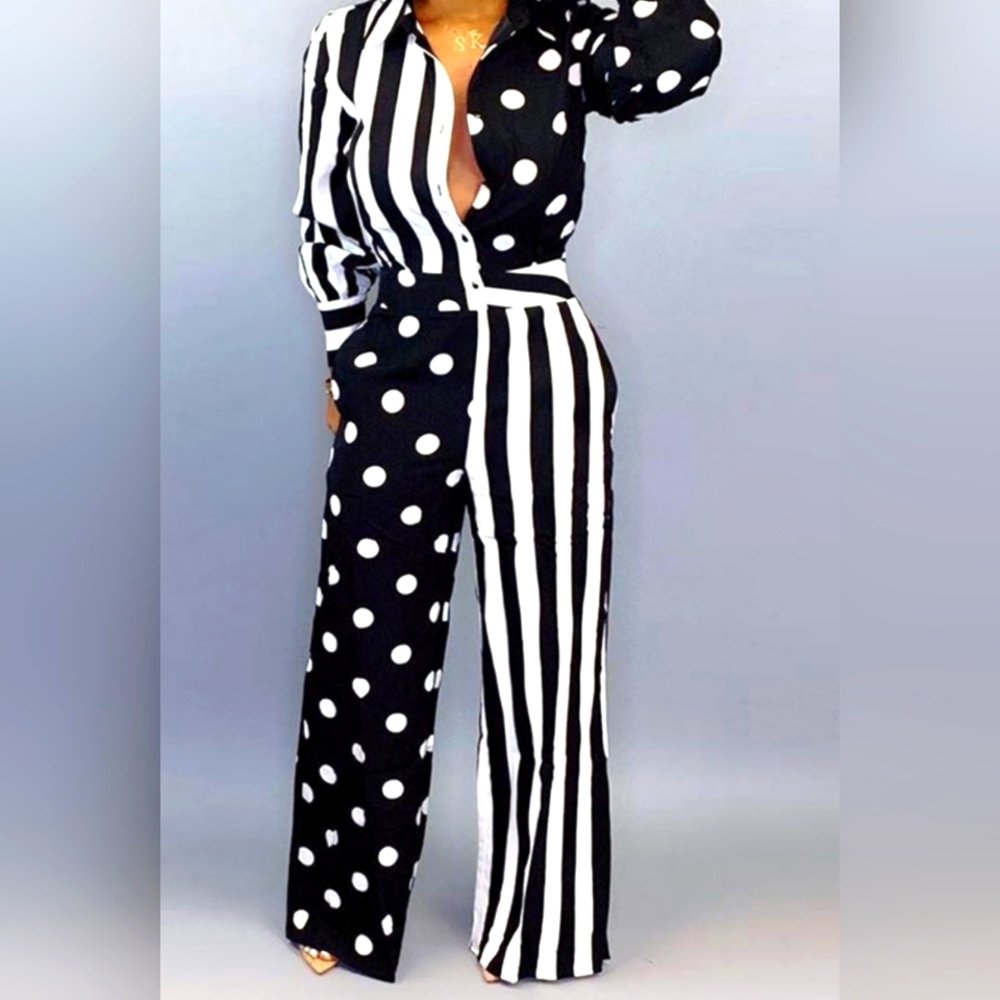 New Esley jumpsuit. Long cuff sleeve. Belt. Front button closure. Small